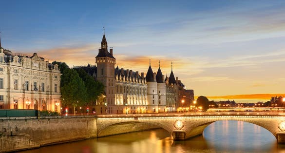 Photo of Consiergerie, Pont Neuf and Seine river at sunny summer sunset, Paris, France