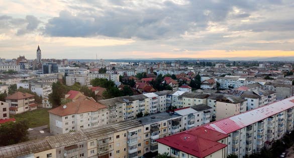 photo of view of Sunrise over the city of Bacău, in Romanian Moldova.