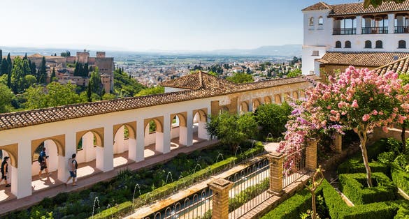 Photo of Sunny view of Granada from viewpoint of Palacio de Generalife, Andalusia province, Spain.