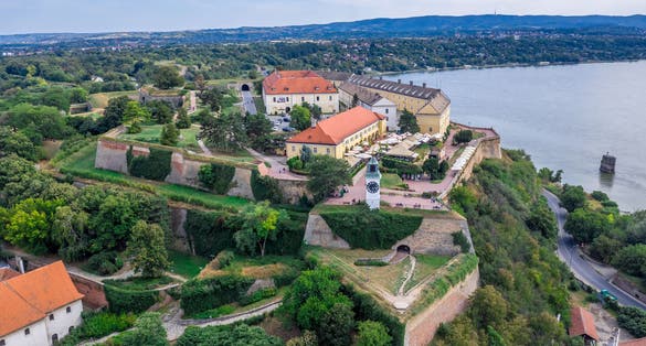 Aerial panoramic view of Petrovaradin fortress trdava above the Danube River across from Novi Sad Serbia with beautiful blue sk