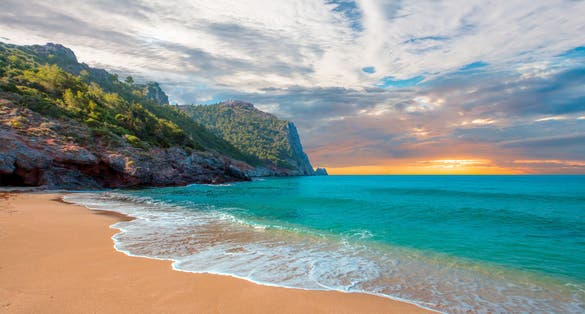 Photo of beach of Cleopatra with sea and rocks ,Antalya, Turkey.