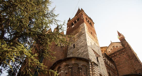 photo of view Exterior of the church of San Fermo Maggiore, Verona, Italy. External view of the apse. The church is a fusion of Romanesque and Gothic style,Fermo italy.