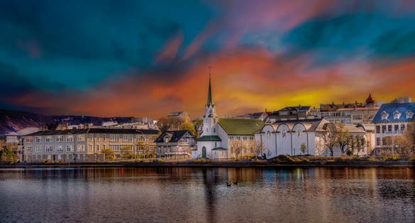 photo of view reikiavik, Lake tjornin - Hraohleoslustoo ON - Frikirkjan, Reykjavík, Iceland.