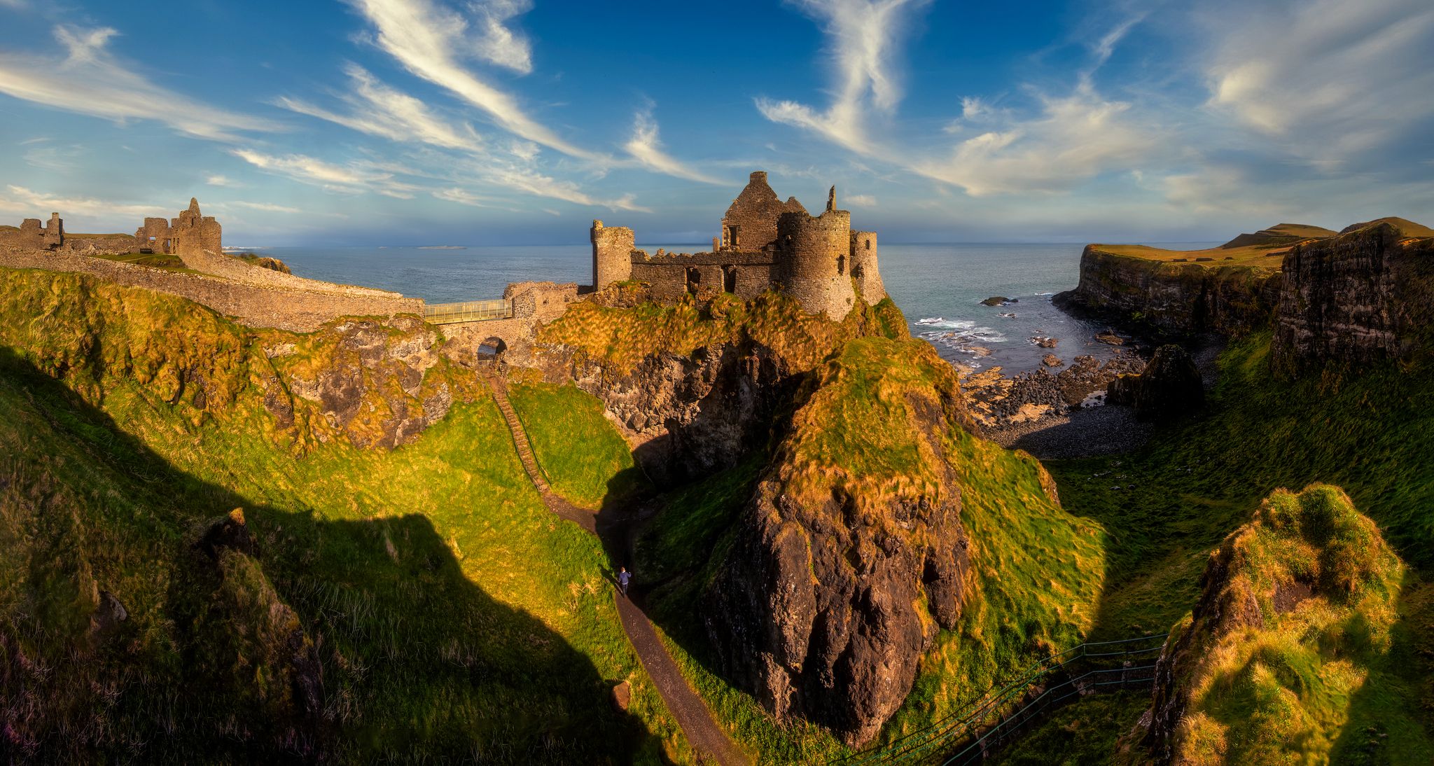 Dunluce Castle is a medieval castle in Bushmills Northern Ireland - big panorama.