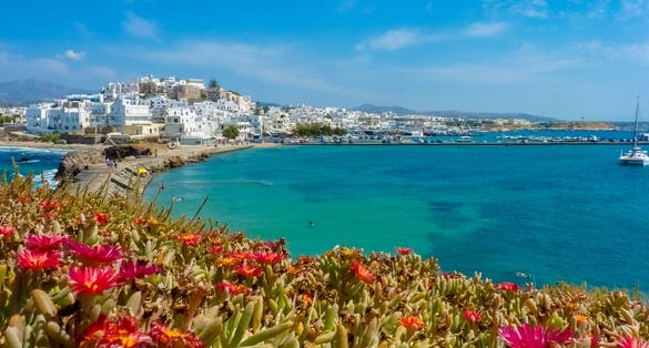 Photo of Chora with beach view, the capital of Naxos island, Cyclades, Greece.