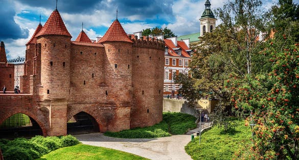 Photo of the Warsaw Barbacan, Polish barbakan warszawski in the summer, Poland.