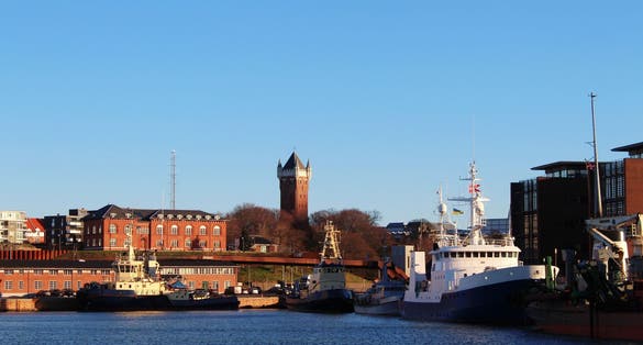 PHOTO OF VIEW OF View to the harbour of Esbjerg, historical water tower in the background, Jutland, Denmark.