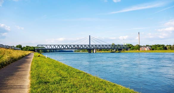 Photo of Rhine bridge in Karlsruhe, view from river rhine bikeway riversides.