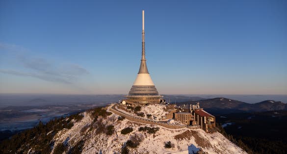 Photo of aerial view of snow-covered Jested, Liberec, Czech Republic.