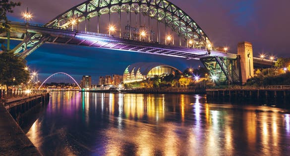 photo of  view  of The Tyne Bridge over the river Tyne in Newcastle, GATESHEAD at night , ENGLAND