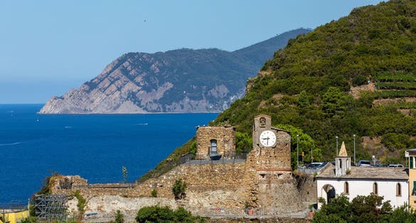 photo of view of Landscape panorama with castle of Riomaggiore, historic building located in the upper part of the historic center of Riomaggiore, in the Cinque Terre, in the province of La Spezia.,Riomaggiore italy.