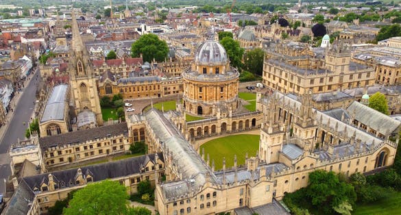 photo of view of Aerial view of the Oxford city, UK. Beautiful medieval city with many castles and traditional English buildings.