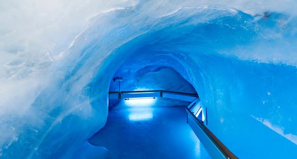 photo of Titlis Glacier Cave tunnel at Mount Titlis, Switzerland. Mount Titlis is a mountain of the Uri Alps at 3,238 meters above sea level.