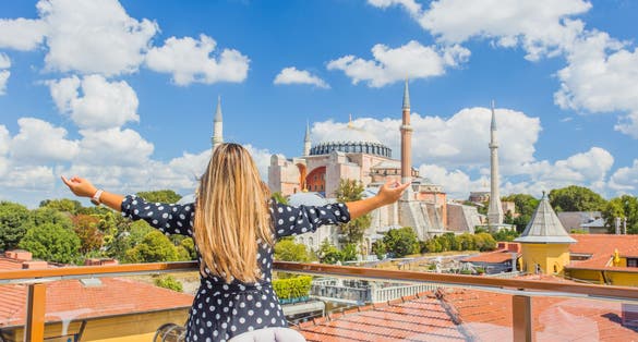 Photo of tourist and wonderful panoramic view of the Istanbul city against the beautiful sky, Turkey.