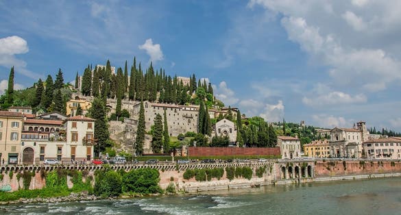 photo of View of the Roman Theater and river in Verona, Italy. View of Roman Theater Archaeological Museum (Museo Archeologico al Teatro Romano) and St. Pietro castle (Castel San Pietro) in Verona