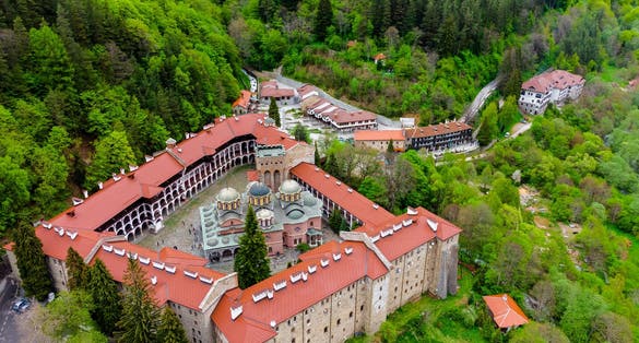 Photo of beautiful aerial view of the vibrant decoration of the Orthodox Rila Monastery, a famous tourist attraction and cultural heritage monument in the Rila Nature Park mountains in Bulgaria.