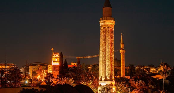 photo of night view of Yivliminare Mosque in Old town Kaleici in Antalya, Turkey.