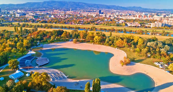Photo of Bundek lake and city of Zagreb aerial autumn view, capital of Croatia.