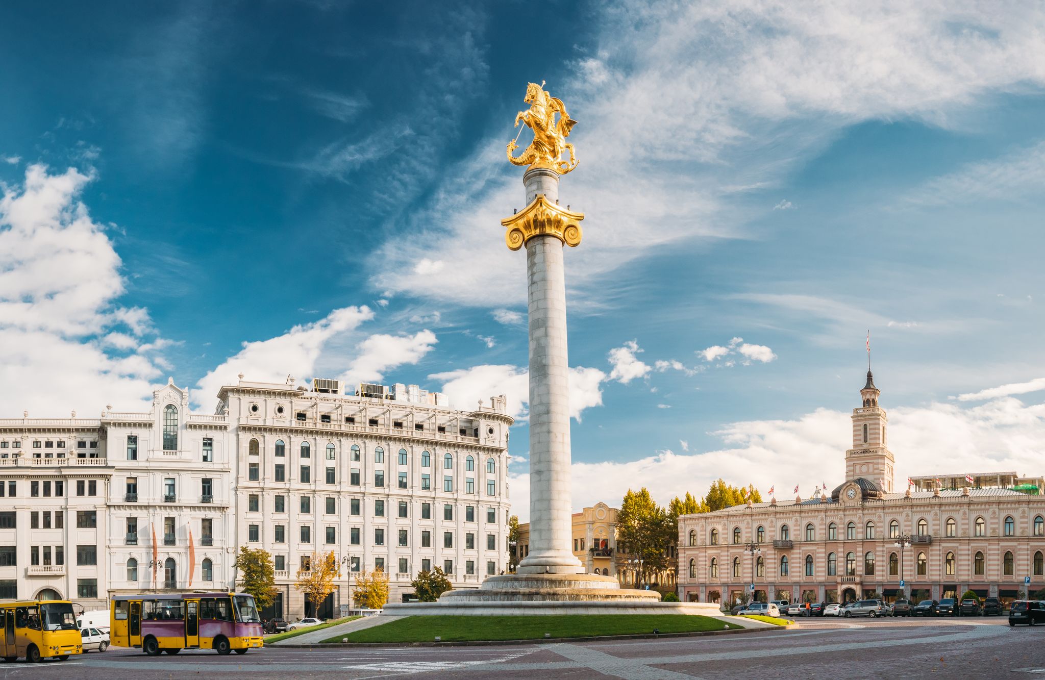 photo of Liberty Monument Depicting St George Slaying the Dragon and Tbilisi City Hall in Freedom Square in City Center in Georgia. Famous Landmark.