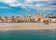 Photo of aerial panoramic view coastline and La Vila Joiosa Villajoyosa touristic resort townscape, sandy beach and Mediterranean seascape, Costa Blanca, Spain.
