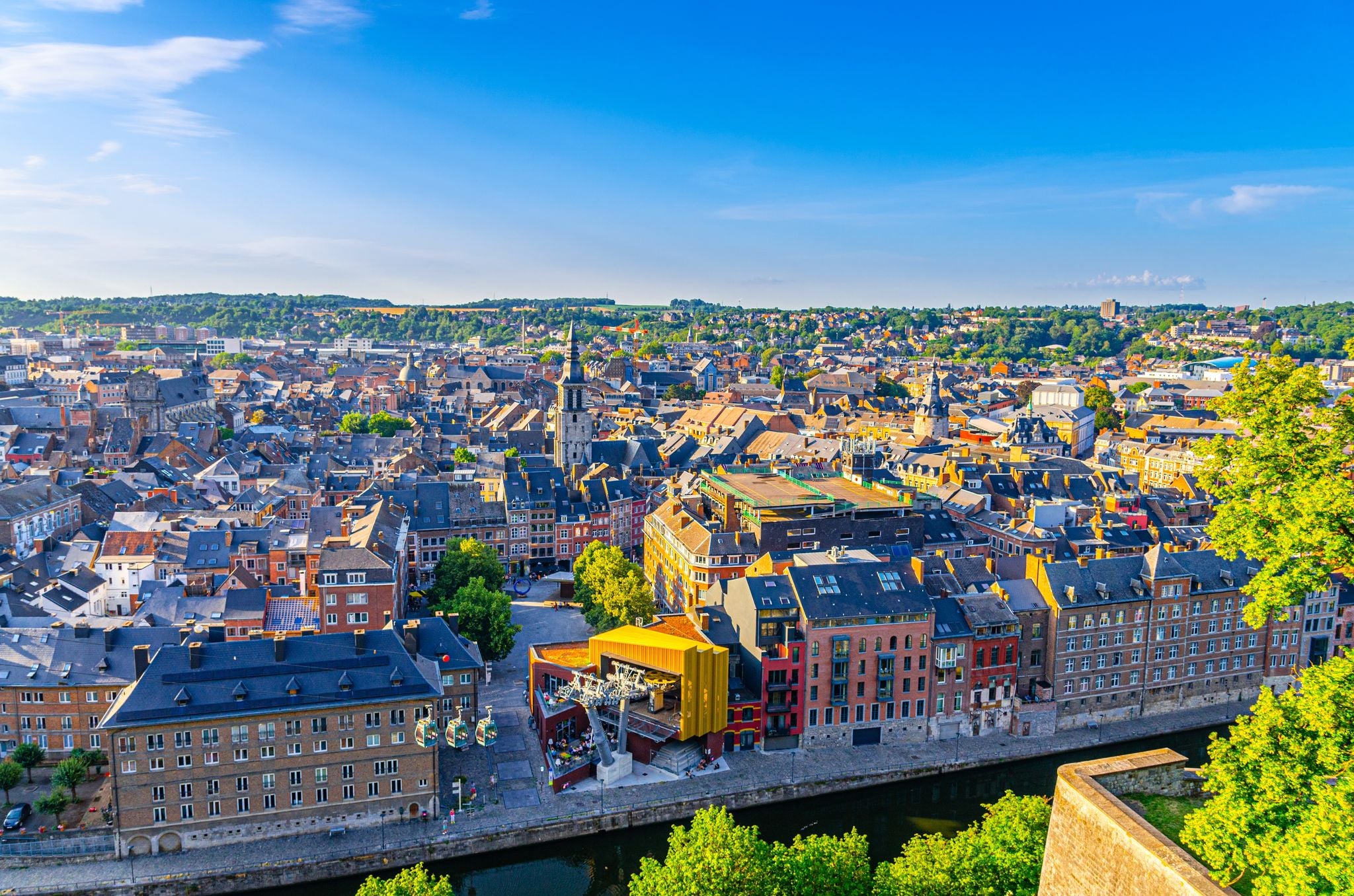 photo of view of  Namur cityscape, aerial panoramic view of old town Namur city historical center with Sambre river embankment, skyline panorama of Namur fields on horizon, Wallonia, Walloon Region, Belgium