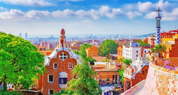 Photo of fantastic view on Barcelona city over Park Guell, famous and popular landmark and travel destination in Europe.