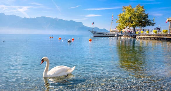 Photo of Quay with old ferry on Lake Geneva in Vevey, Vaud canton, Switzerland.