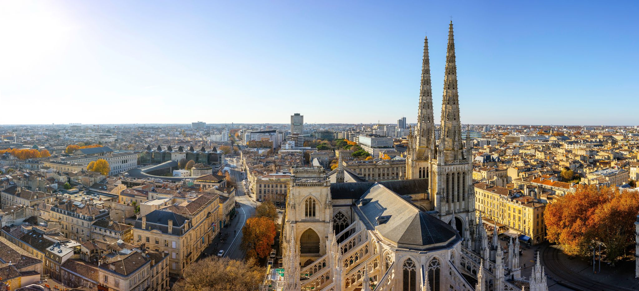 photo of stunning panoramic aerial cityscape from Pey Berland tower of St. Andrew's Cathedral beautiful sunny evening of warm golden autumn, Bordeaux, Gironde, Nouvelle-Aquitaine, France.