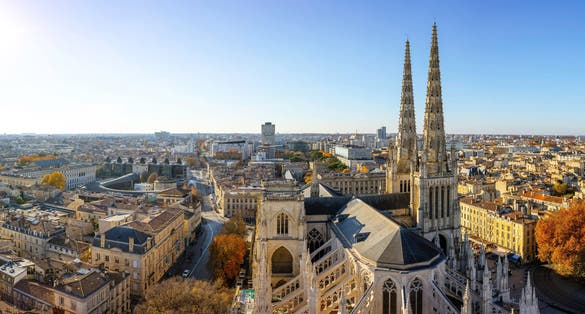 photo of stunning panoramic aerial cityscape from Pey Berland tower of St. Andrew's Cathedral beautiful sunny evening of warm golden autumn, Bordeaux, Gironde, Nouvelle-Aquitaine, France.