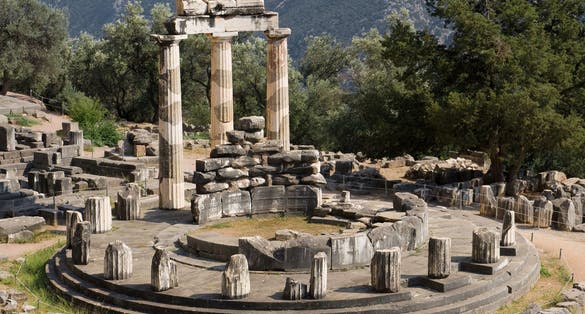 photo of view of Tholos at the sanctuary of Athena Pronaia, Delphi, Greece.