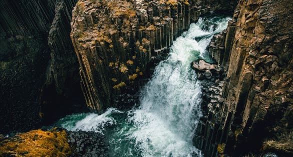 photo of A different perspective on famous Litlanesfoss waterfall near Hengifoss, in eastern Iceland.