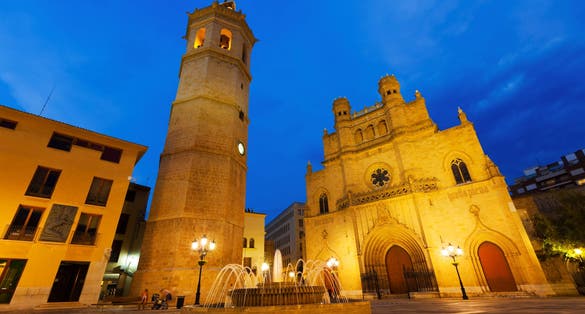 Photo of Wide angle shot of Fadri tower and Gothic Cathedral at Plaza Mayor in night. Castellon de la Plana, Spain .
