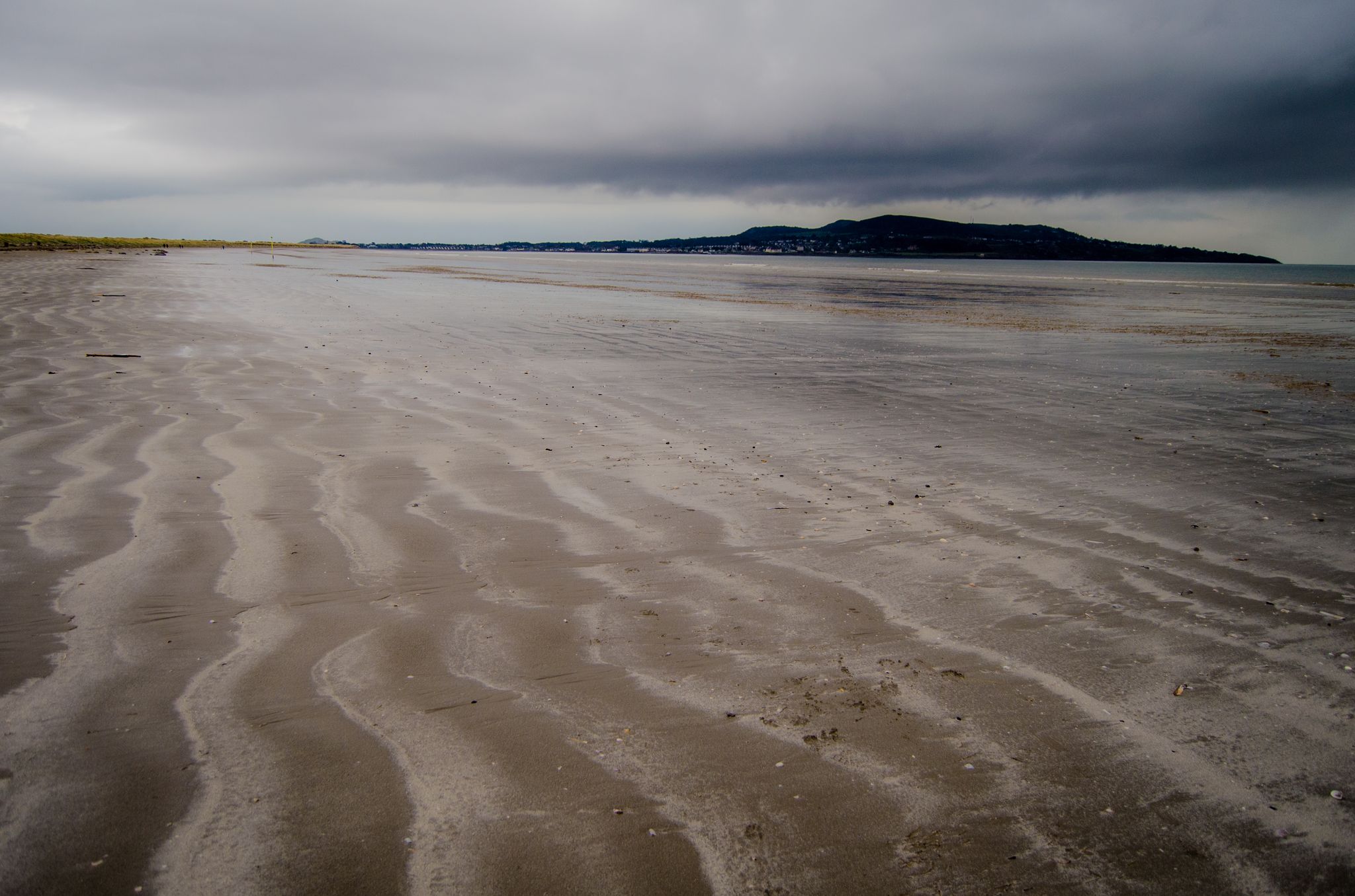 photo of Bull Island - Ireland, Beach and Beachrocks on a Rainy Day .