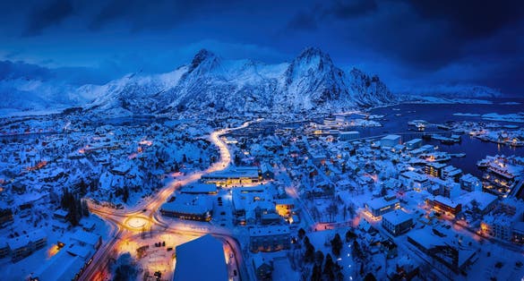 Panoramic winter view of Svolvaer in the night, Lofoten Islands, Norway. Blue hour winter view.