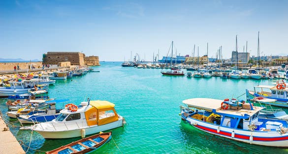 Photo of old venetian harbor with boats in Heraklion, Crete island, Greece.