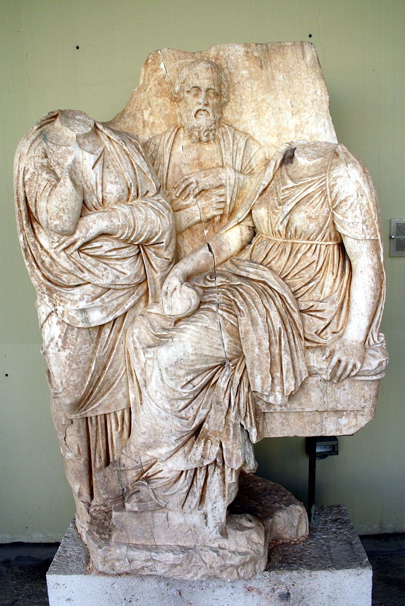 photo of view Funerary relief for a girl, flanked by her parents, Municipality of Piraeus, Greece.