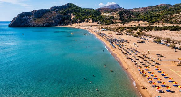Photo of Tsampika beach with golden sand view from above, Rhodes, Greece.