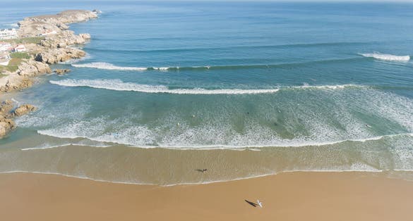 Photo of aerial view of Peniche's sandy beach and Atlantic Ocean in summer.