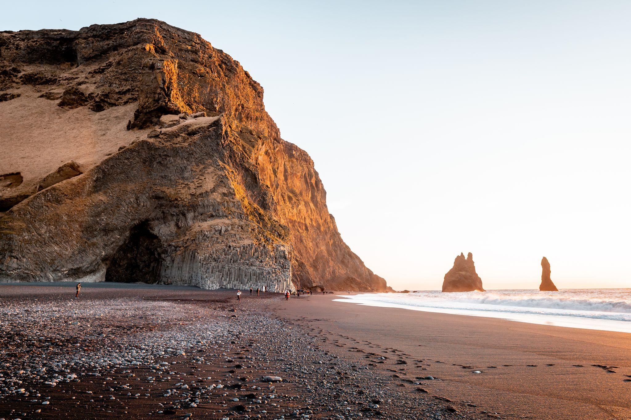 photo of  Hálsanefshellir Cave, a beautiful cave on a black sand beach during sunrise in Iceland.