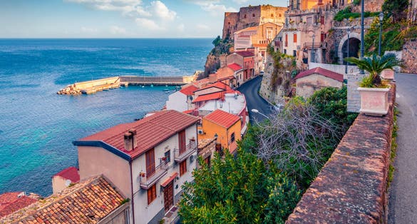 photo of  view of Amazing morning view of Scilla town with Ruffo castle on background, administratively part of the Metropolitan City of Reggio Calabria, Italy. Attractive summer seascape of Mediterranean sea.