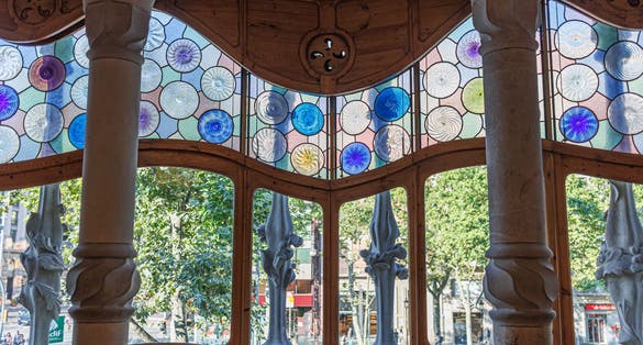 Photo of Interior of Famous Casa Batllo in Barcelona, detail of the Stained Glass Windows, Spain.