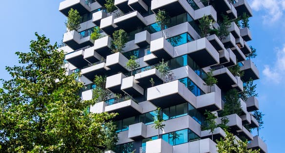 Eindhoven, The Netherlands, June 29th, 2021. Vertical garden tower with trees creating greenery and nature for the social housing residents of the city, Strijp S.