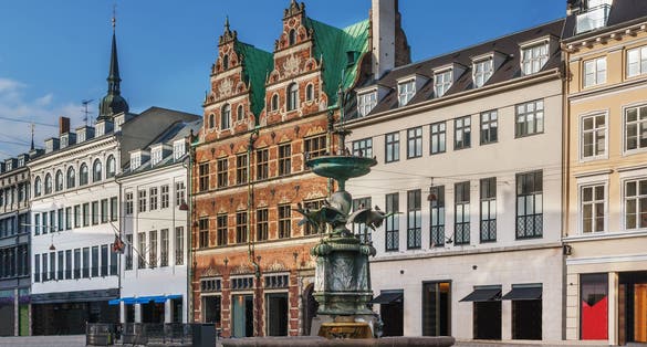 Photo of Stork Fountain on the Amagertorv (Amager Square) and the longest pedestrian street in the world Stroget in Copenhagen, Denmark.