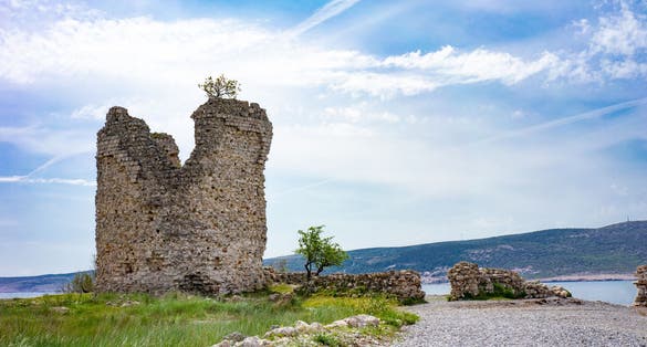 Photo of Večka kula tower and the blue coast, Croatia.