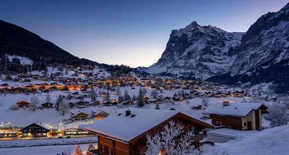 Photo of Winter landscape in Grindelwald at sunrise, behind the Mittelhorn and Wetterhorn, in the Bernese Oberland - Switzerland .