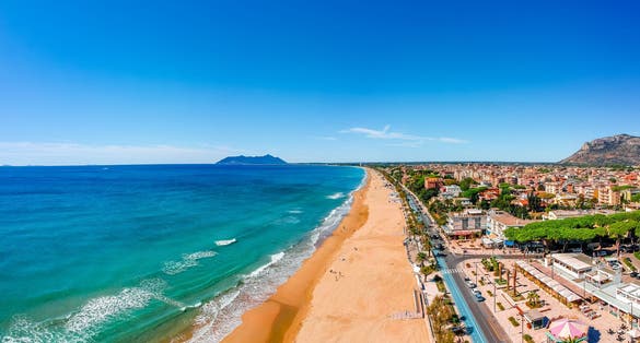 Panoramic sea landscape with Terracina, Lazio, Italy. Scenic resort town village with nice sand beach and clear blue water. Famous tourist destination in Riviera de Ulisse