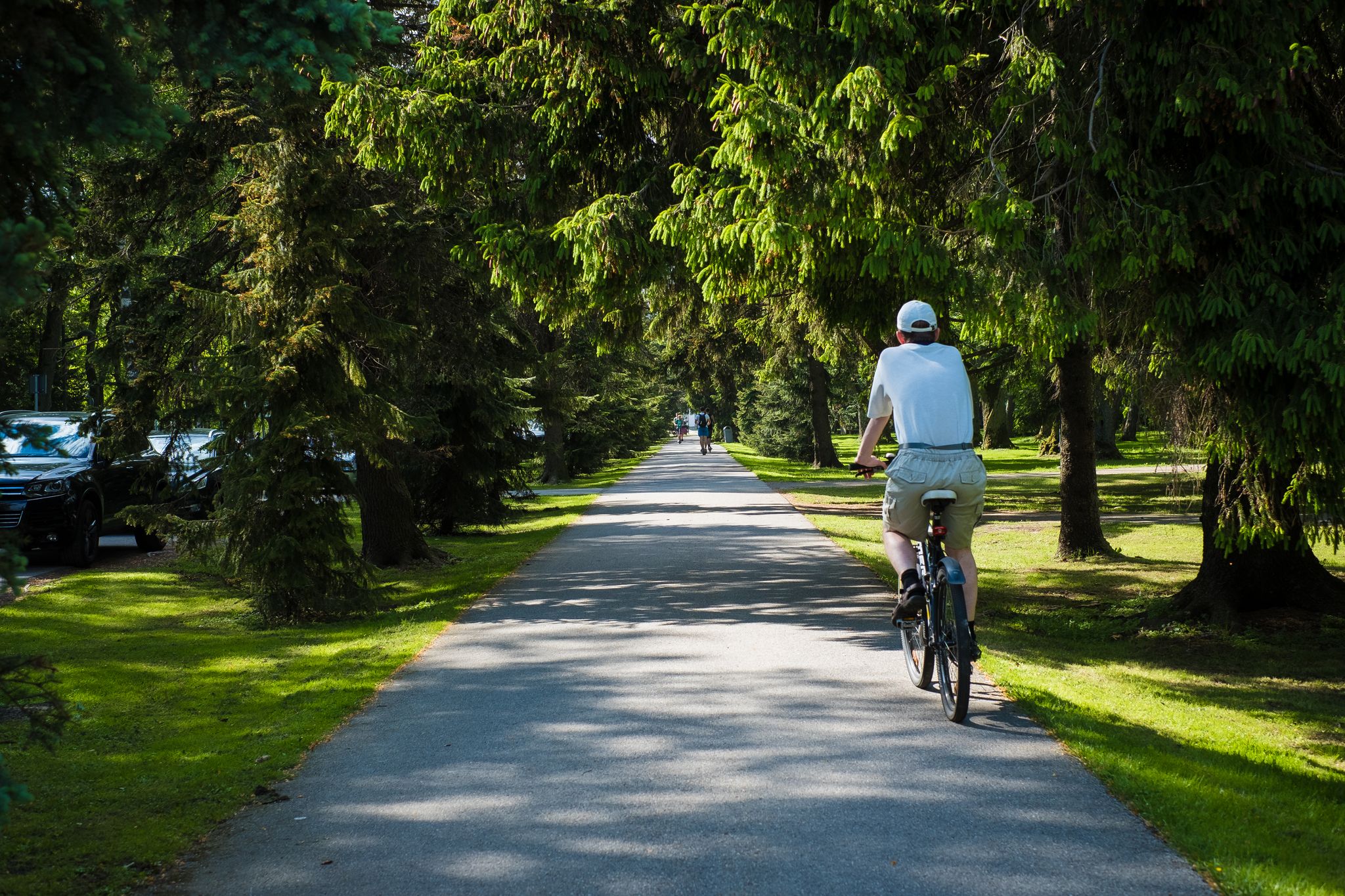 Photo of cyclist riding in Pärnu Rannapark (Pärnu Beach Park). Popular walking and recreation area in Pärnu.