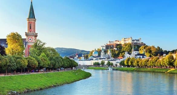 Photo of beautiful view of Salzburg skyline with Festung Hohensalzburg and Salzach river in summer, Austria.