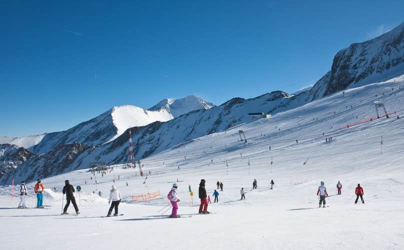 photo of people skiing at ski resort of Kaprun, Kitzsteinhorn glacier. Austria.