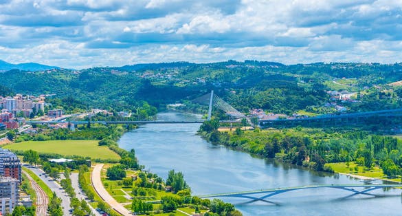 Valley of river Mondego and Ponte Rainha Santa Isabel bridge at Coimbra, Portugal